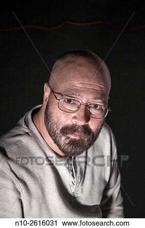 Middle age bald man with a beard and glasses. View Large Photo Image Stock Image - Middle age bald man with a beard and glasses.. Fotosearch