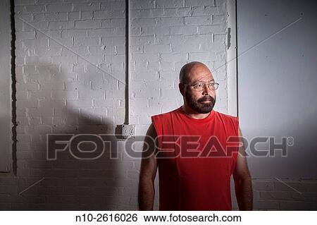 Middle age bald man with a beard and wearing glasses. View Large Photo Image Stock Photograph - Middle age bald man with a beard and wearing glasses.. Fotosearch