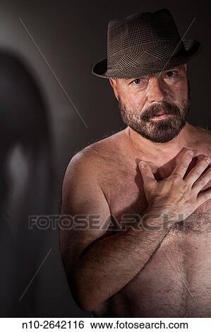 Middle age man wearing a hat and no shirt. View Large Photo Image Stock Photograph - Middle age man wearing a hat and no shirt.. Fotosearch