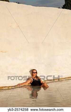 Middle Aged Female Sitting In A Pool, Pamukkale, Denizli Provence, Turkey. View Large Photo Image Stock Photo - Middle Aged Female Sitting In A Pool, Pamukkale, Denizli Provence, Turkey.. Fotosearch
