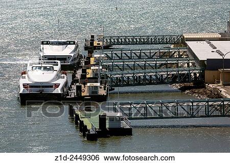 Stock Photograph - Modern ferries at Tagus river in Lisbon Portugal at. Terminal fluvial the ferry terminal Cais do Sodre area central Lisbon Portugal Europe.. Fotosearch