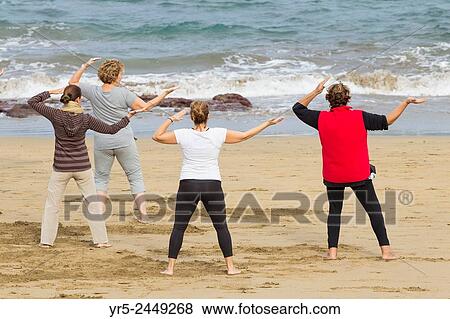 Morning Tai Chi on Las Canteras beach in Las Palmas, Gran Canaria, Canary Islands, Spain. View Large Photo Image Stock Photo - Morning Tai Chi on Las Canteras beach in Las Palmas, Gran Canaria, Canary Islands, Spain.. Fotosearch