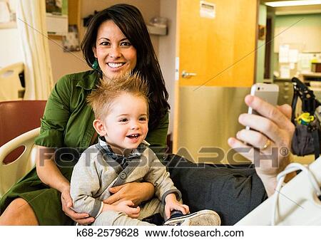Stock Photo - mother and baby boy visit in the hospital.. Fotosearch