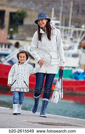 Mother and daughter in the fishing port. Getaria. Gipuzkoa. Basque Country. Spain View Large Photo Image Stock Photo - Mother and daughter in the fishing port. Getaria. Gipuzkoa. Basque Country. Spain. Fotosearch