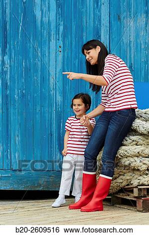 Mother and daughter in the fishing port. Getaria. Gipuzkoa. Basque Country. Spain View Large Photo Image Stock Photograph - Mother and daughter in the fishing port. Getaria. Gipuzkoa. Basque Country. Spain. Fotosearch