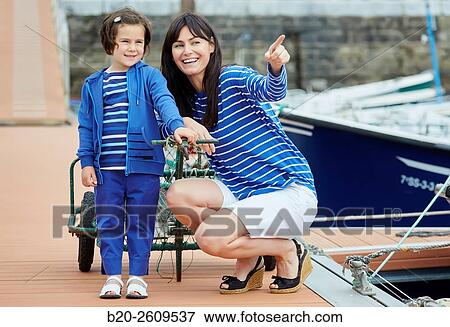 Mother and daughter in the marina. Port. Getaria. Gipuzkoa. Basque Country. Spain View Large Photo Image Stock Photo - Mother and daughter in the marina. Port. Getaria. Gipuzkoa. Basque Country. Spain. Fotosearch