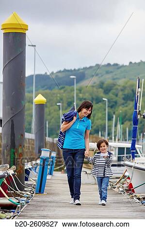 Mother and daughter walking in the marina. Port. Getaria. Gipuzkoa. Basque Country. Spain View Large Photo Image Stock Photo - Mother and daughter walking in the marina. Port. Getaria. Gipuzkoa. Basque Country. Spain. Fotosearch
