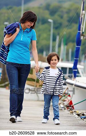 Mother and daughter walking in the marina. Port. Getaria. Gipuzkoa. Basque Country. Spain View Large Photo Image Stock Photo - Mother and daughter walking in the marina. Port. Getaria. Gipuzkoa. Basque Country. Spain. Fotosearch