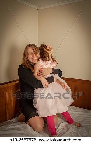 Mother playing with her six year old daughter. View Large Photo Image Stock Photograph - Mother playing with her six year old daughter.. Fotosearch