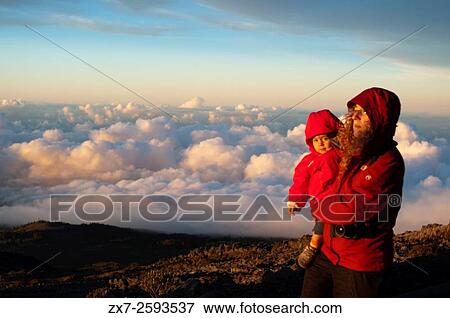 Mother with her daughter in Haleakala National Park. Views from the viewpoint of Leleiwi. Maui. Hawaii. View Large Photo Image Stock Photo - Mother with her daughter in Haleakala National Park. Views from the viewpoint of Leleiwi. Maui. Hawaii.. Fotosearch