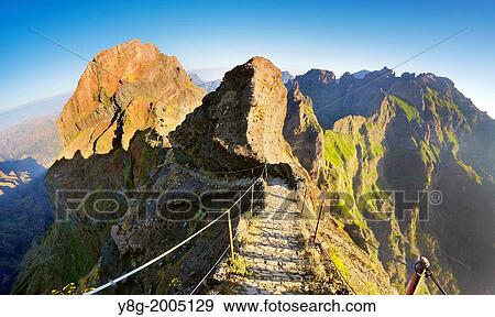 Stock Photo - Mountain hiking trail from Pico do Aeeiro to Pico Ruivo, Madeira, Portugal.. Fotosearch