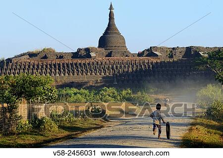 Myanmar, Rakhine State, Mrauk U, Koethaung pagoda, Child at play. View Large Photo Image Stock Image - Myanmar, Rakhine State, Mrauk U, Koethaung pagoda, Child at play.. Fotosearch