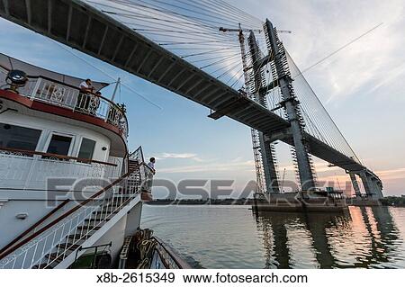 Stock Photo - New bridge crossing the Tonle Sap River headed towards Phnom Penh, Cambodia.. Fotosearch