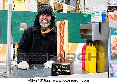 New York, USA. Egyptian immigrant to the united States selling Hot Dogs & Pretsels from his mobile stand, Down Town Manhattan. View Large Photo Image Stock Image - New York, USA. Egyptian immigrant to the united States selling Hot Dogs & Pretsels from his mobile stand, Down Town Manhattan.. Fotosearch
