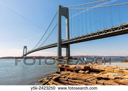 Stock Image - New York, USA. The Staten Island / Verrazano Narrows Bridge between Brooklyn and Staten Island, as seen from Shore Parkway.. Fotosearch