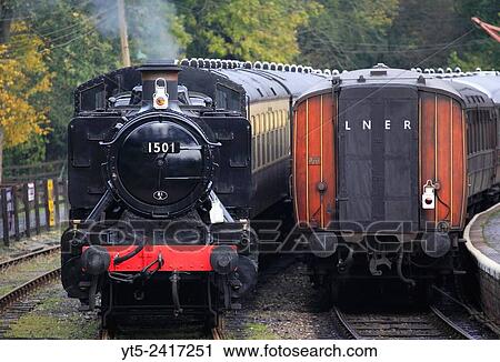 No. 1501 waits in a siding as a passeneger train departs Highley, Severn Valley Railway, Shropshire, England, Europe. View Large Photo Image Stock Image - No. 1501 waits in a siding as a passeneger train departs Highley, Severn Valley Railway, Shropshire, England, Europe.. Fotosearch