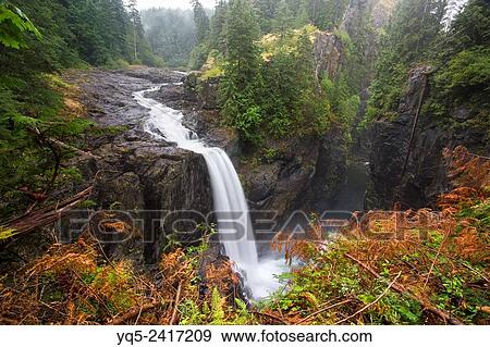 Stock Photo - North America, Canada, British Columbia, Vancouver Island, Elk Falls Provincial Park, Elk Falls, 25 metre waterfall on the Campbell River.. Fotosearch