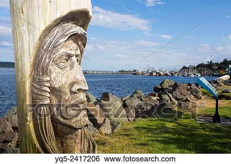 Stock Photograph - North America, Canada, British Columbia, Vancouver Island, Campbell River, waterfront, totem.. Fotosearch