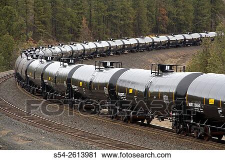Oil tanker cars on a train hauling oil through Washington State, USA. View Large Photo Image Stock Image - Oil tanker cars on a train hauling oil through Washington State, USA.. Fotosearch