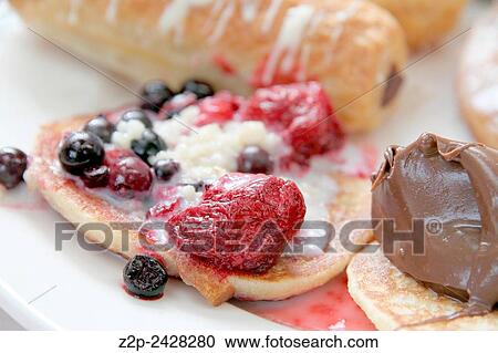 Pancakes with red fruits and chocolate. View Large Photo Image Stock Image - Pancakes with red fruits and chocolate.. Fotosearch