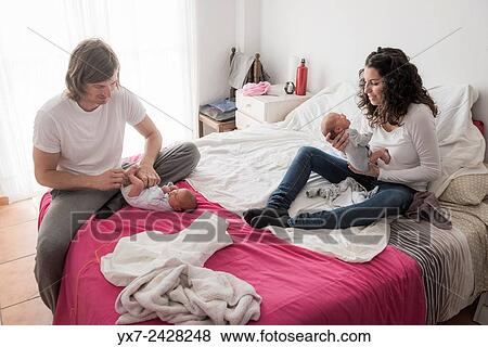 Parents with new born twins. View Large Photo Image Stock Photo - Parents with new born twins.. Fotosearch