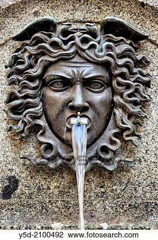 Part of Escalade Fountain on crossing of Rue de la Cite and Rue de la Confederation, memorial to Genevas historical victory over the French - Savoyard troops on December 11-12 in 1602, old town of Geneva, here bronze Medusa's head, sculptor - Johannes Lee View Large Photo Image Stock Image - Part of Escalade Fountain on crossing of Rue de la Cite and Rue de la Confederation, memorial to Genevas historical victory over the French - Savoyard troops on December 11-12 in 1602, old town of Geneva, here bronze Medusa's head, sculptor - Johannes Lee. Fotosearch