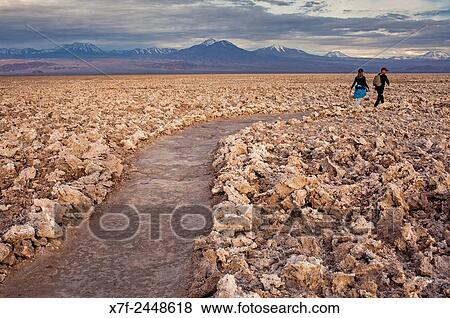 Stock Photo - Path across Salt formations in Atacama Salt Flat, in background the Andes, Atacama Desert, Regi? n de Antofagasta, Chile.. Fotosearch