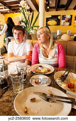 People having lunch at a Uk cafe. View Large Photo Image Stock Image - People having lunch at a Uk cafe.. Fotosearch