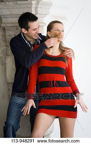 Playful young couple, playing with her hair View Large Photo Image Stock Image - Playful young couple, playing with her hair. Fotosearch