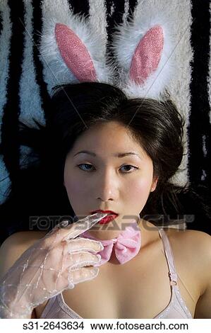 portrait of a beautiful young asian girl wearing a halloween costume. View Large Photo Image Picture - portrait of a beautiful young asian girl wearing a halloween costume.. Fotosearch