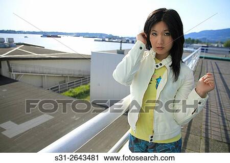 Stock Image - portrait of a beautiful young asian girl from canada.. Fotosearch