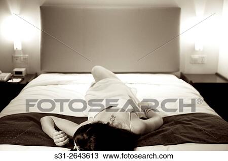 portrait of a beautiful young Chinese girl playing on bed. View Large Photo Image Stock Image - portrait of a beautiful young Chinese girl playing on bed.. Fotosearch
