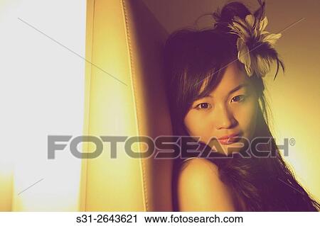 portrait of a beautiful young Chinese girl playing on bed. View Large Photo Image Stock Image - portrait of a beautiful young Chinese girl playing on bed.. Fotosearch