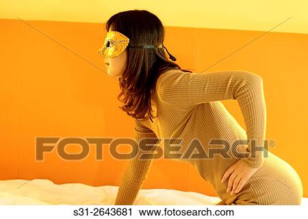 portrait of a beautiful young Chinese girl wearing a mask. View Large Photo Image Stock Image - portrait of a beautiful young Chinese girl wearing a mask.. Fotosearch