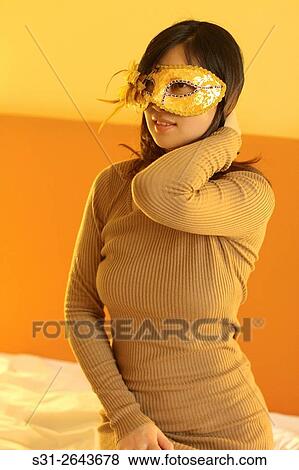 portrait of a beautiful young Chinese girl wearing a mask. View Large Photo Image Stock Photo - portrait of a beautiful young Chinese girl wearing a mask.. Fotosearch