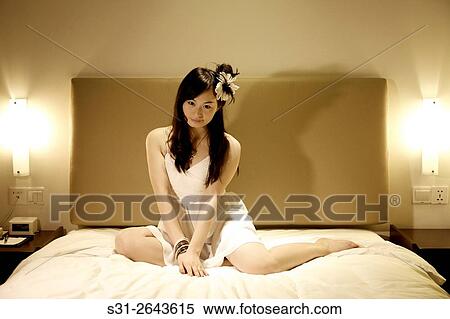portrait of a beautiful young Chinese girl playing on bed. View Large Photo Image Stock Photography - portrait of a beautiful young Chinese girl playing on bed.. Fotosearch