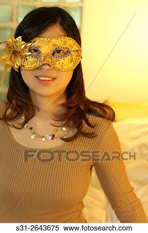 portrait of a beautiful young Chinese girl wearing a mask. View Large Photo Image Stock Photography - portrait of a beautiful young Chinese girl wearing a mask.. Fotosearch