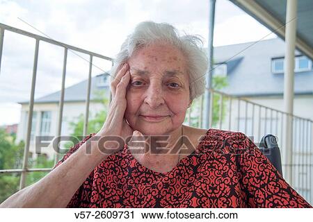 Portrait of elderly woman in a nursing home, smiling and looking at the camera. Close view. View Large Photo Image Stock Image - Portrait of elderly woman in a nursing home, smiling and looking at the camera. Close view.. Fotosearch