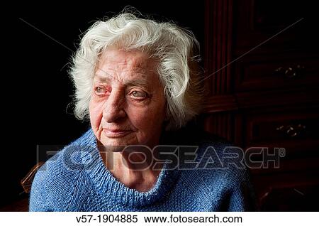 Stock Photography - Portrait of old woman at home, looking up. Close view.. Fotosearch