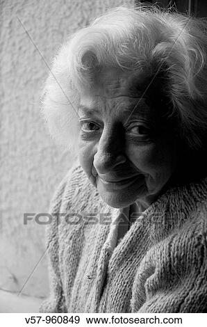 Portrait of old woman smiling and looking at the camera. Black and White. View Large Photo Image Stock Photo - Portrait of old woman smiling and looking at the camera. Black and White.. Fotosearch