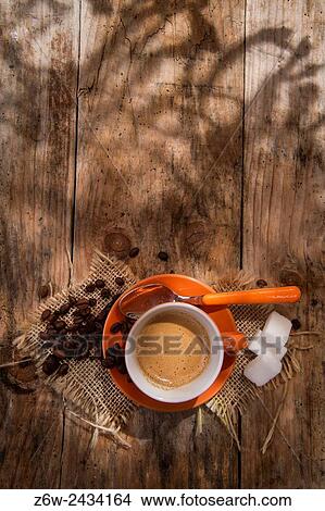 Presentation of a cup of hot coffee with coffee beans and sugar cubes. View Large Photo Image Picture - Presentation of a cup of hot coffee with coffee beans and sugar cubes.. Fotosearch