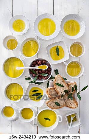 Presentation of wholemeal bread and olives with olive oil. View Large Photo Image Stock Photo - Presentation of wholemeal bread and olives with olive oil.. Fotosearch