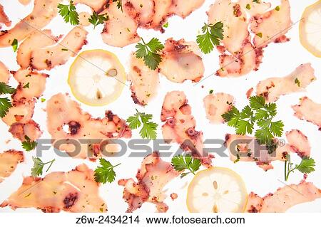 Presentation portion of octopus carpaccio co lemon and olive oil. View Large Photo Image Picture - Presentation portion of octopus carpaccio co lemon and olive oil.. Fotosearch