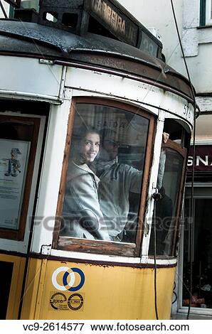 Pretty girl in a yellow tram in Lisbon. View Large Photo Image Stock Photo - Pretty girl in a yellow tram in Lisbon.. Fotosearch