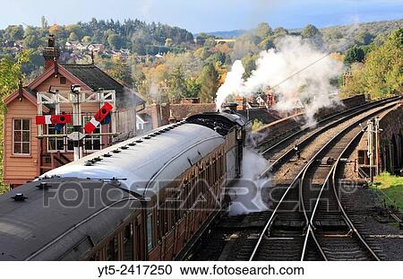 Stock Image - Ready to depart a passenger train prepares to head into the Severn Valley, Bewdley, Severn Valley Railway, Worcestershire, England, Europe.. Fotosearch