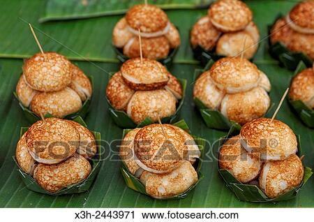 Stock Image - rice cakes at the morning market, Luang Prabang, Laos, Southeast Asia.. Fotosearch