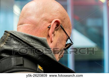 Rotterdam, Netherlands. Balding, pondering man wearing glasses. View Large Photo Image Stock Photo - Rotterdam, Netherlands. Balding, pondering man wearing glasses.. Fotosearch