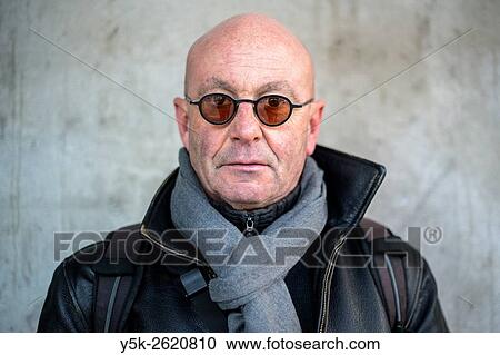 Rotterdam, Netherlands. Portrait of a balding, middle aged man wearig glasses in front of a concrete pillar. View Large Photo Image Stock Image - Rotterdam, Netherlands. Portrait of a balding, middle aged man wearig glasses in front of a concrete pillar.. Fotosearch