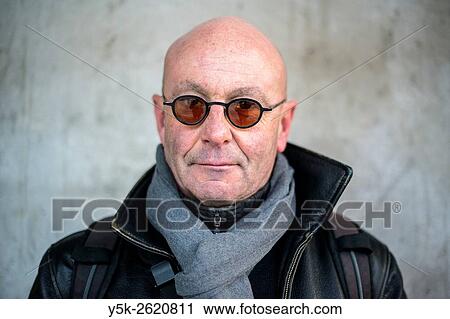Rotterdam, Netherlands. Portrait of a balding, middle aged man wearig glasses in front of a concrete pillar. View Large Photo Image Stock Image - Rotterdam, Netherlands. Portrait of a balding, middle aged man wearig glasses in front of a concrete pillar.. Fotosearch