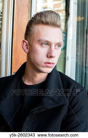 Rotterdam, Netherlands. Portrait young, blonde man just after recieving his new hairdue at Schorem Barbers and Haircutters. View Large Photo Image Stock Image - Rotterdam, Netherlands. Portrait young, blonde man just after recieving his new hairdue at Schorem Barbers and Haircutters.. Fotosearch
